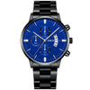 Black luxury watch with blue dial and round face