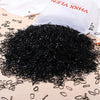 Black elastic hair bands in a pile