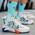 Men's basketball shoes with artistic design and orange sole