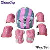 Pink and gray kids protective gear set with helmet and pads.