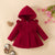 Cozy red fleece hooded coat for girls, ruffle details.