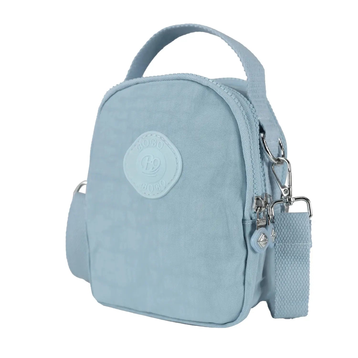 Light blue lightweight women's crossbody bag with adjustable strap and zippered compartments, ideal for travel and everyday use.