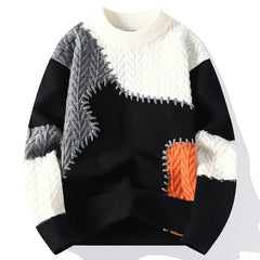 Men's winter fashion sweater in black, white, and orange patchwork design.