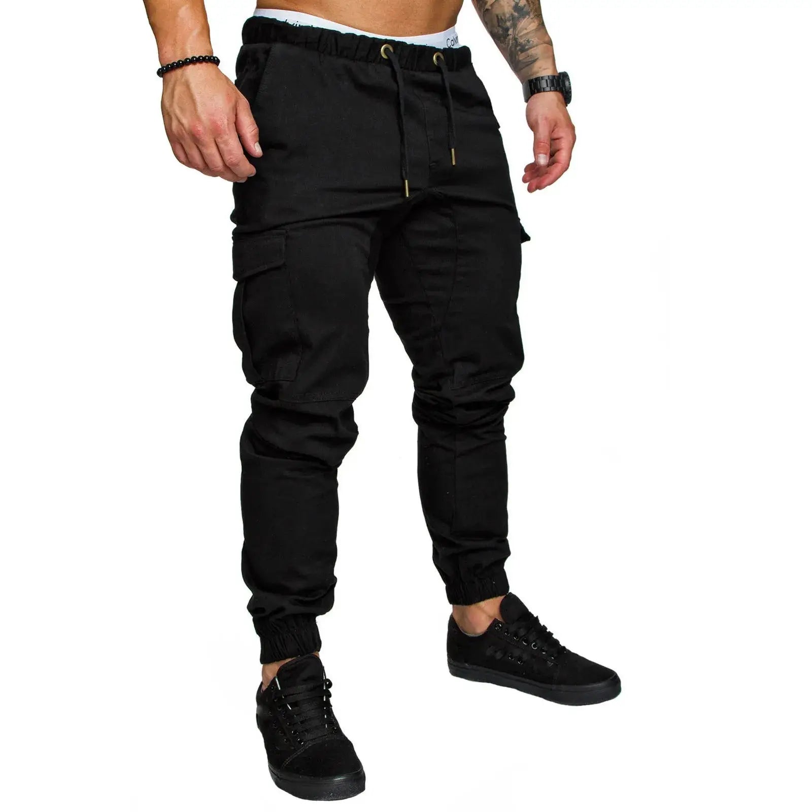 Black men’s drawstring skinny cargo pants with ankle cuffs and flap pockets, crafted for versatile daily wear.