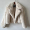 White luxury fur coat on hanger