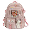 Light pink backpack with bear and rainbow designs