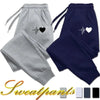 Gray and navy sweatpants with heart design