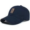 Navy cotton baseball cap with a brown patch.