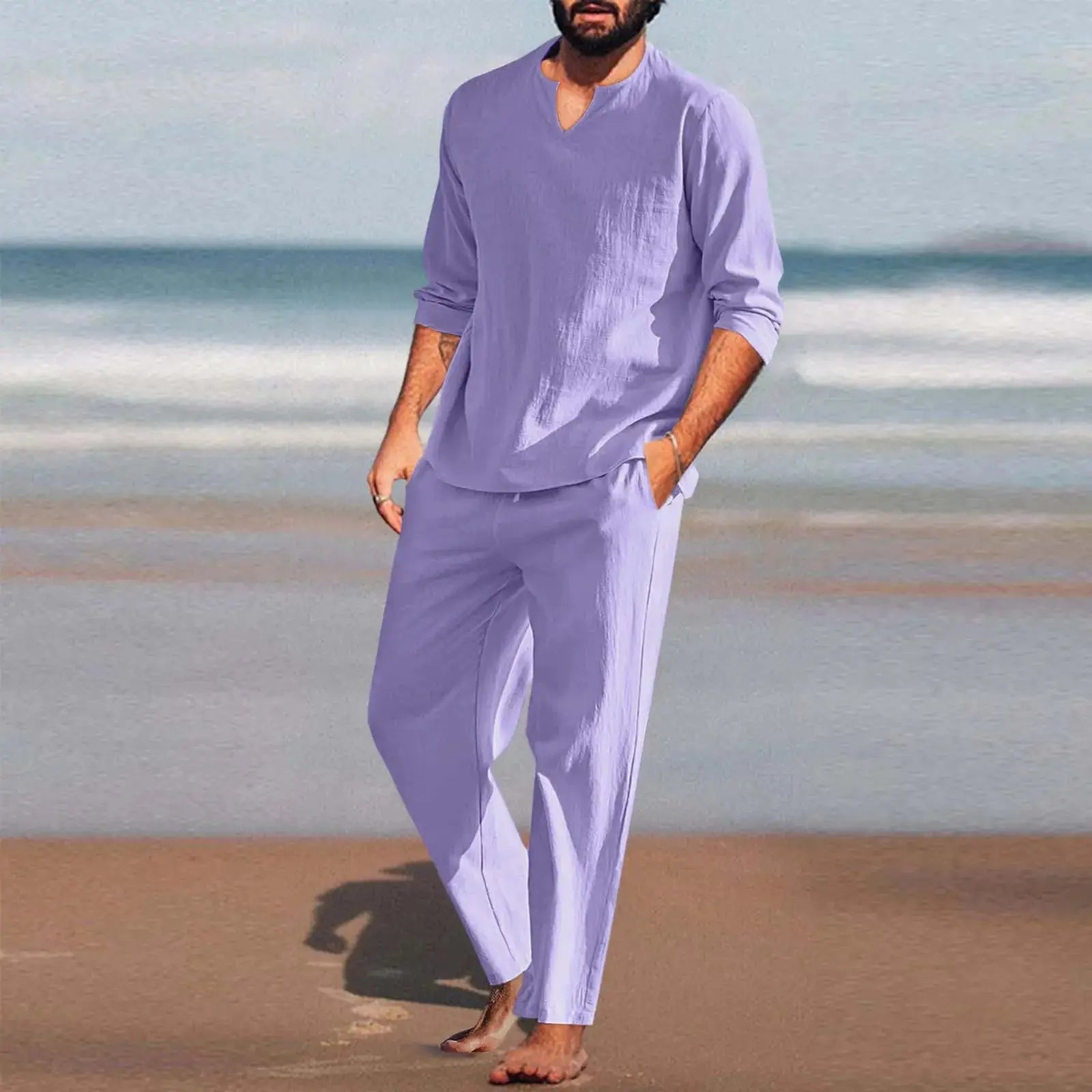 Lavender men’s 2-piece cotton linen set worn on the beach, showcasing lightweight shirt and loose pants for summer comfort and style.