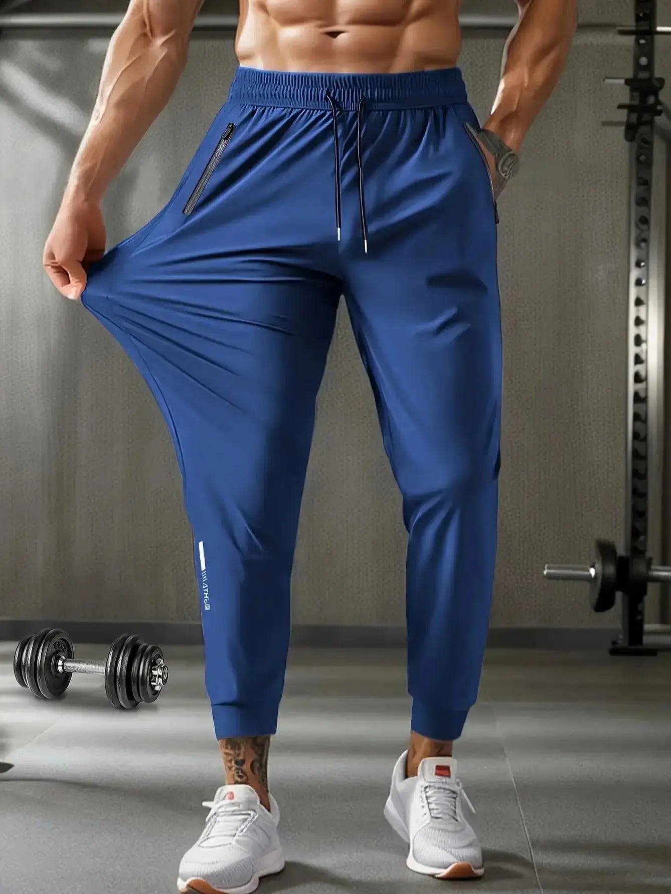 Mens Quick-Dry Training Pants in blue with stretchable fabric, elastic waist, and zipper pockets, perfect for gym and outdoor activities.