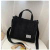 Black women's corduroy bag with handles and strap