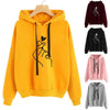 Yellow hoodie with heart hand design