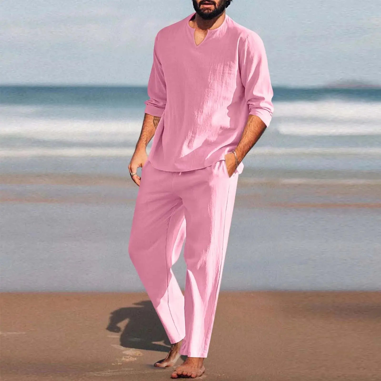 Pink men’s 2-piece cotton linen set modeled on the beach, breathable summer outfit with relaxed fit for yoga, beach, or casual wear.