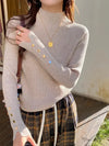 Gray ribbed women's sweater with button accents