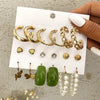 Gold earring set with green and pearls