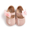 Pink patent baby shoes with flower design