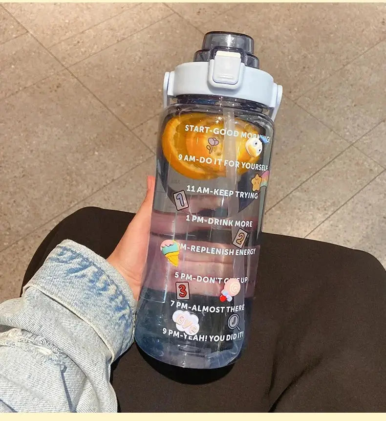 2L hydration jug in light blue with straw and time marker, featuring fruit infuser and cute stickers for fitness and summer water intake tracking.