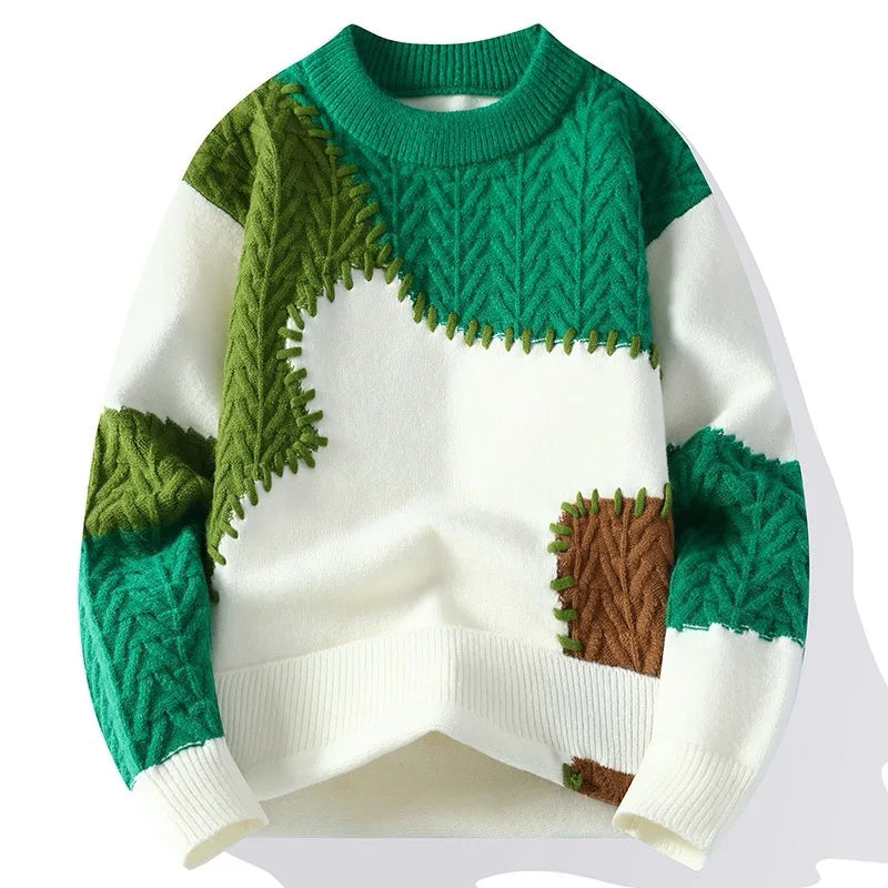 Men's winter fashion sweater in green and white patchwork design.