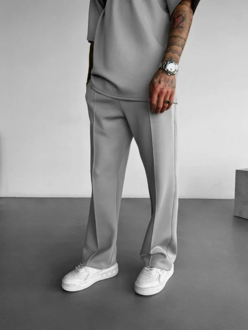 Light gray men's casual pants with elastic waist and stylish fit.