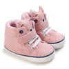 Pink baby sneakers with animal face