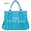 Lake blue tote bag with bold text design