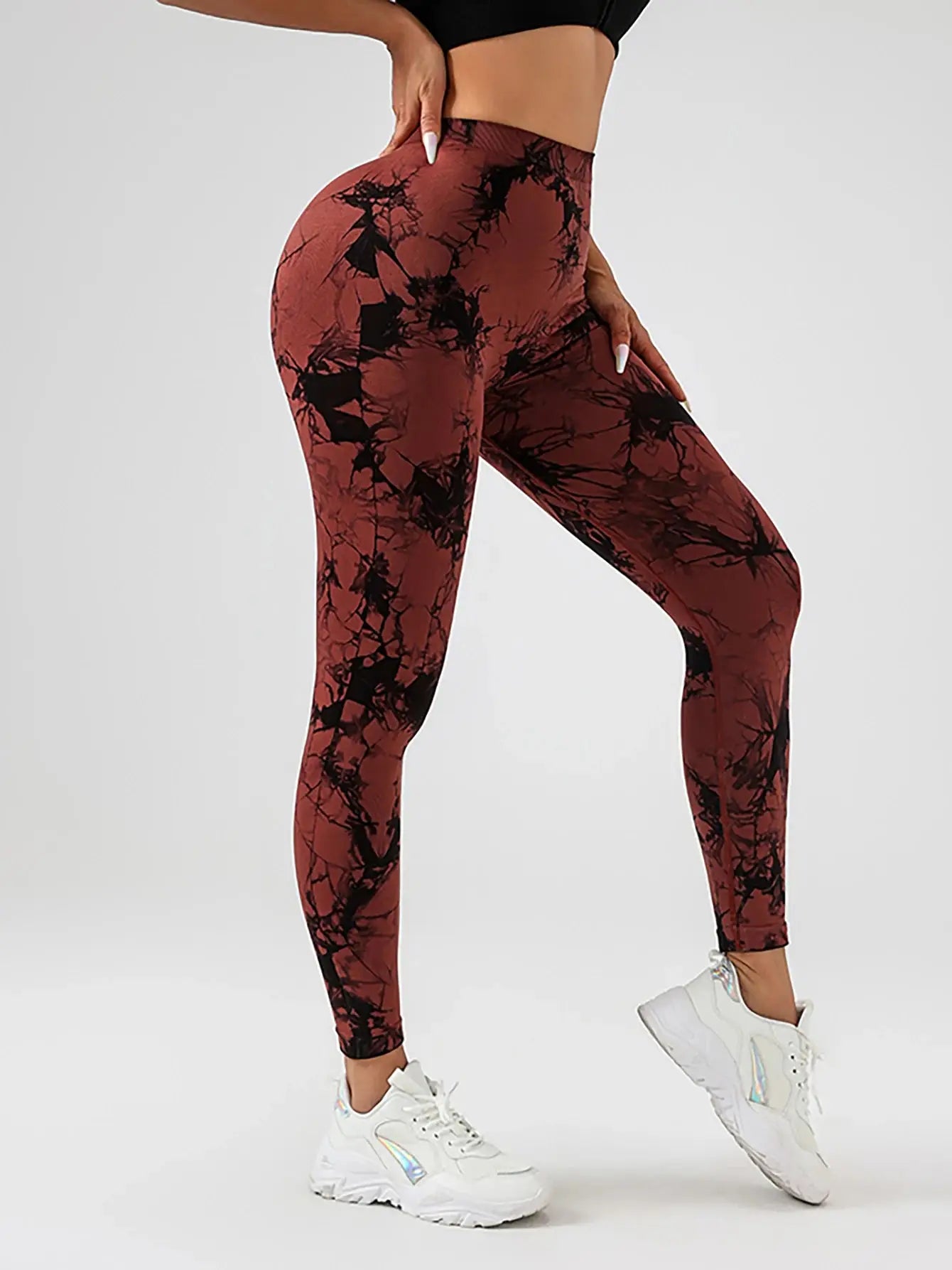 Side view of red and black US Women's Spandex Tie Dye Scrunch Butt Lifting High Waist Leggings, combining comfort and fashion-forward activewear.