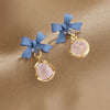 Sweet round opal drop earrings with blue bowknot design