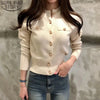 Beige long sleeve knitted sweater with button details