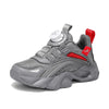 Gray children's sneakers with red accents, anti-slippery design