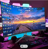 Curved desktop monoblock with vibrant display and keyboard.