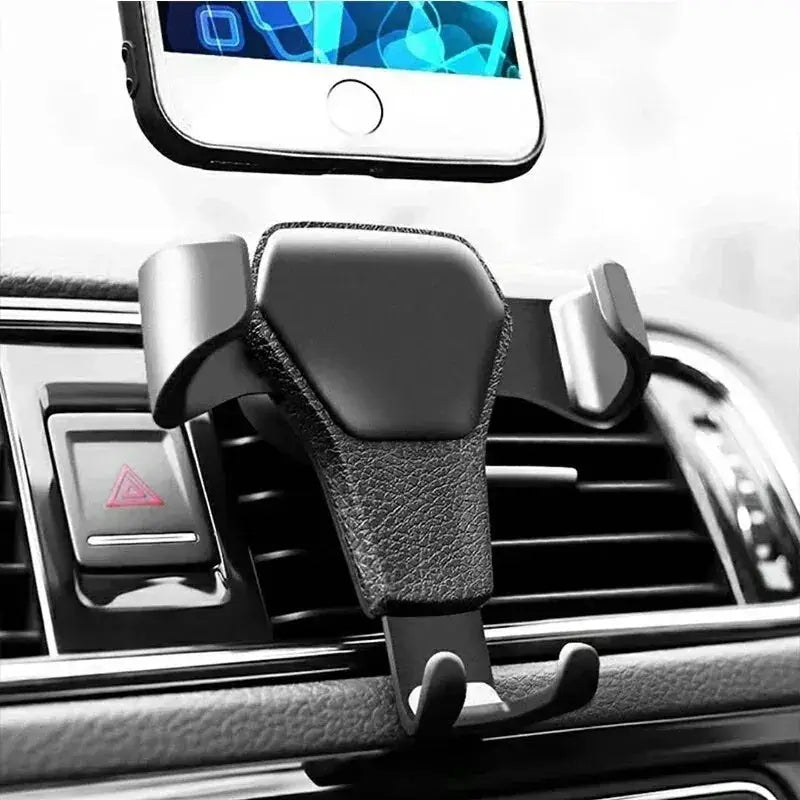 Universal gravity phone and GPS holder mounted on car air vent, offering hands-free smartphone support with sleek black design.