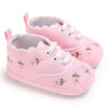 Pink baby shoes with floral embroidery