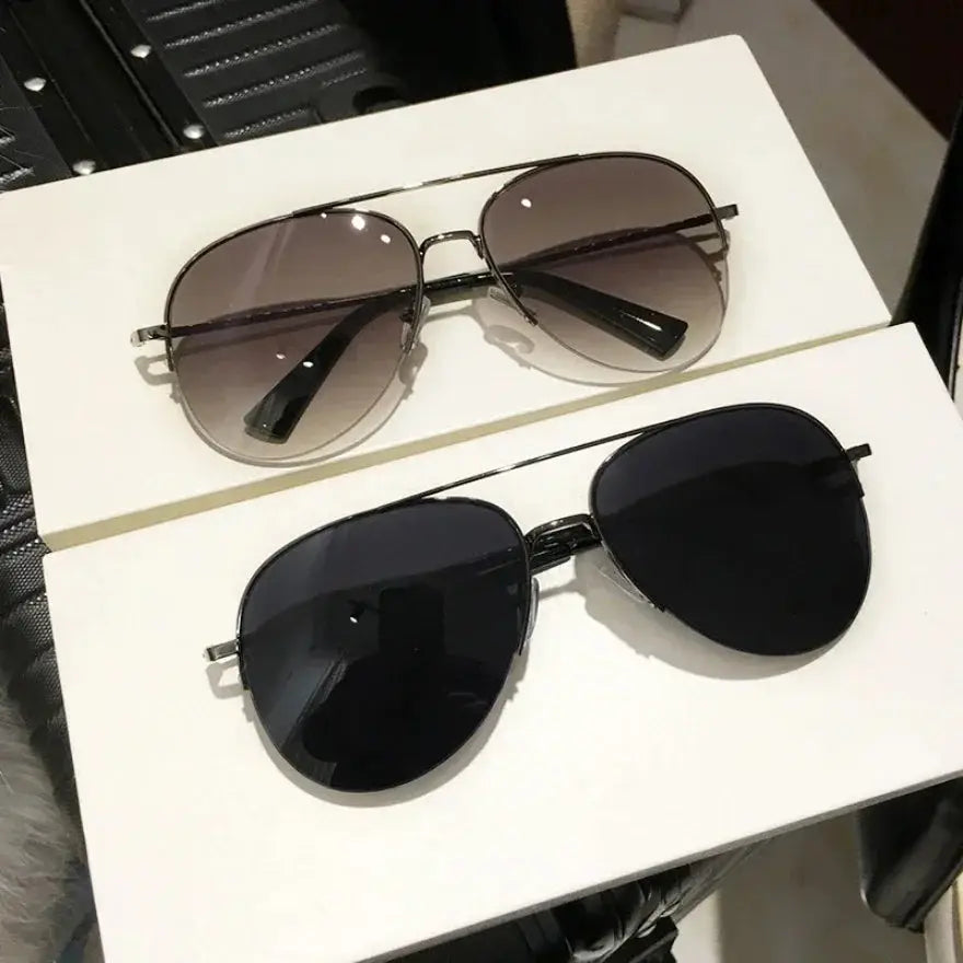 Polarized UV400 sunglasses with black and gray lenses for men & women. Anti-glare eyewear suitable for driving and outdoor activities.
