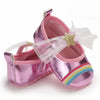 Pink metallic baby shoes with rainbow detail