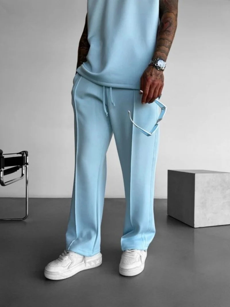 Light blue men's casual pants with elastic waist and adjustable drawstring.