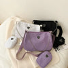 Collection of women's bags in black, white, and purple