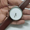 Minimalist watch with brown leather strap