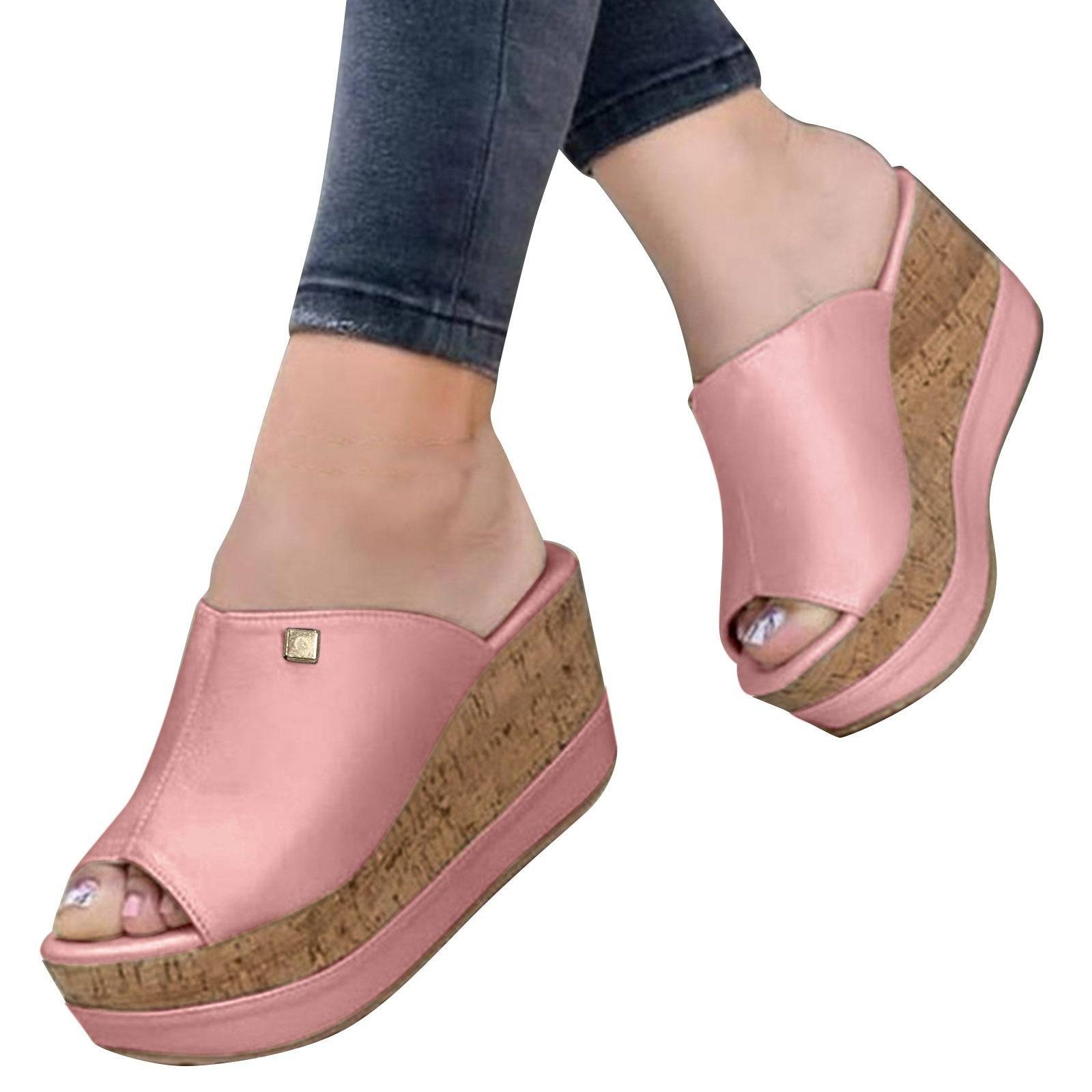 Pink Roman-style wedge sandals on model with cork platform, perfect for casual and elegant summer outfits.