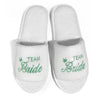 White slippers with green 'Team Bride' embroidery