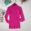 Bright pink women's turtleneck sweater on hanger