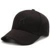 Black baseball cap with subtle embroidered letters