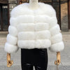 White faux fur coat on mannequin outdoors