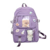 Purple backpack with bear and duck embellishments