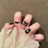 Black French nails with lace and bow details