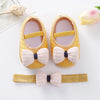 Yellow textured bowknot shoes for baby girls