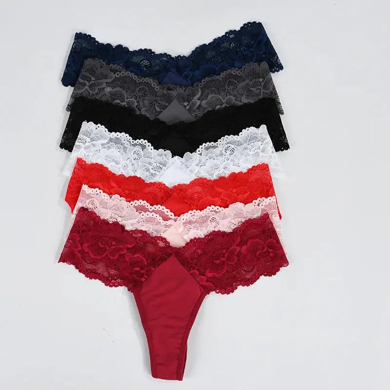 Flat lay of 7-piece lace thong bikini set in multicolor, including red, pink, black, white, and navy for women's daily wear.