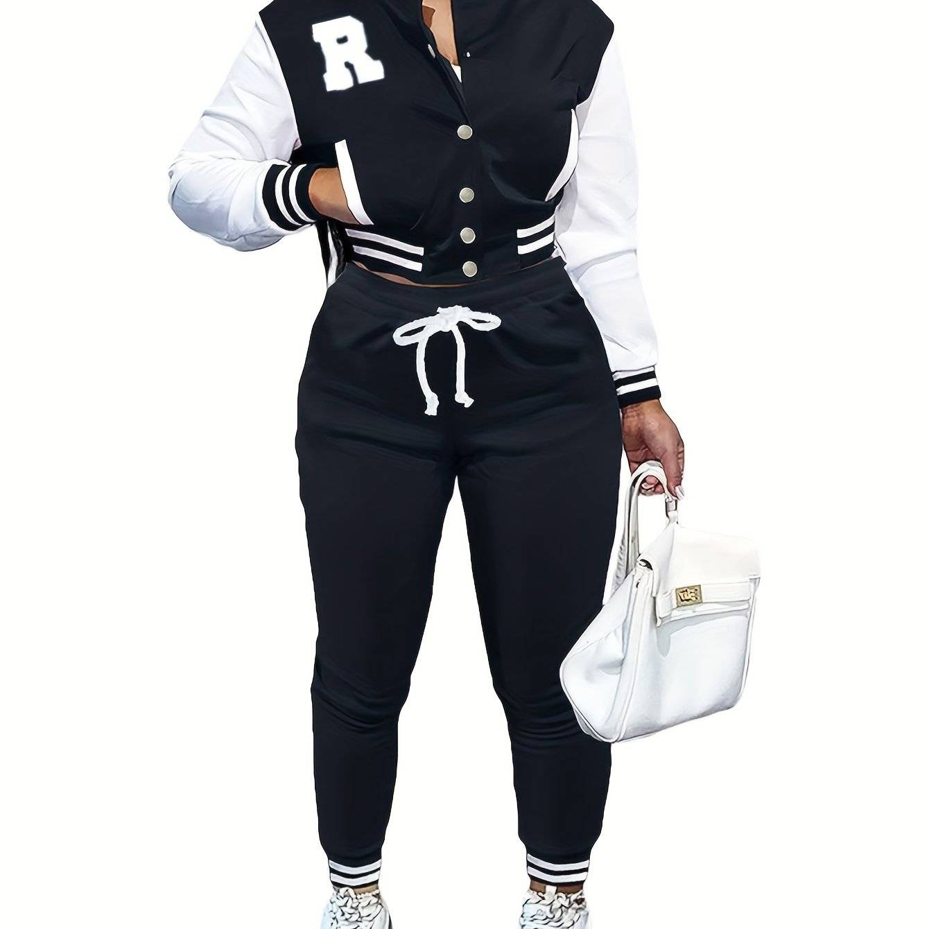 Black women’s 2-piece sportswear set with white varsity jacket sleeves and jogger pants, perfect for a sleek and sporty appearance.