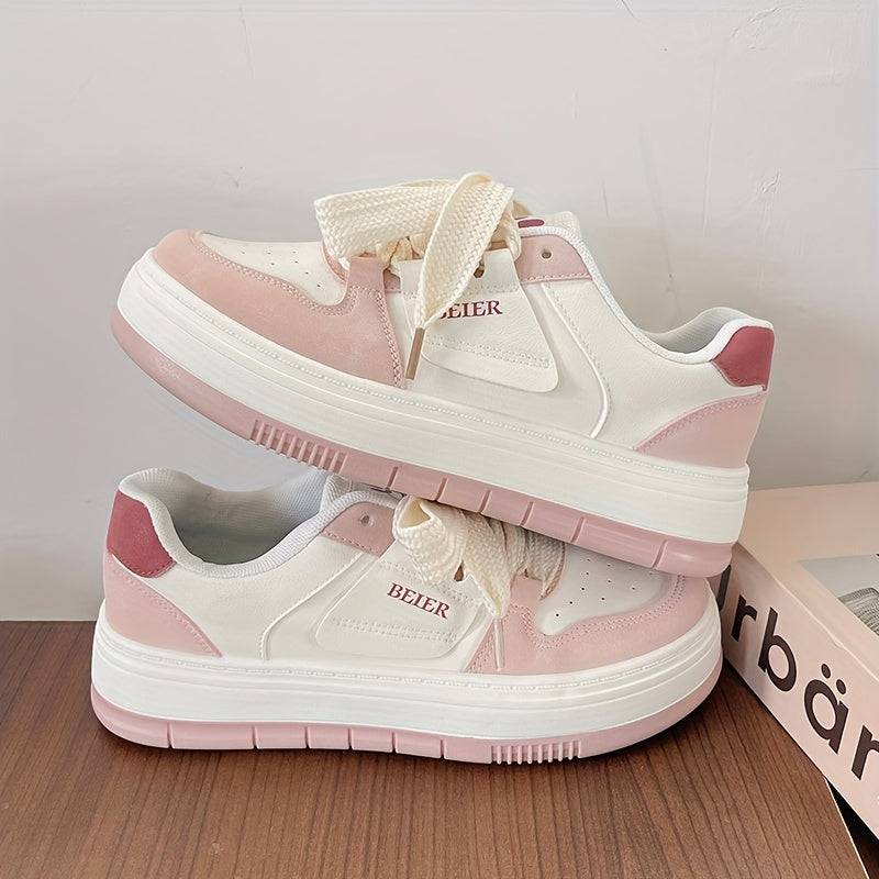 Side view of women’s pink & white casual sneakers with thick sole and lace-up closure, designed for comfort and grip.