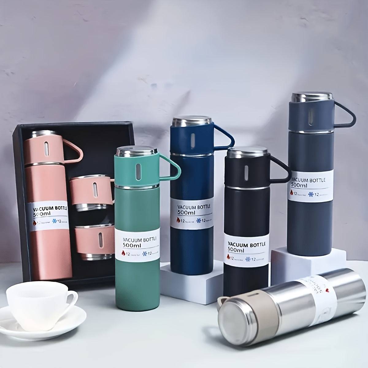 Insulated stainless steel bottle set with 500ml flask and 3 cups in assorted colors, ideal for school or office use. Displayed with gift packaging.