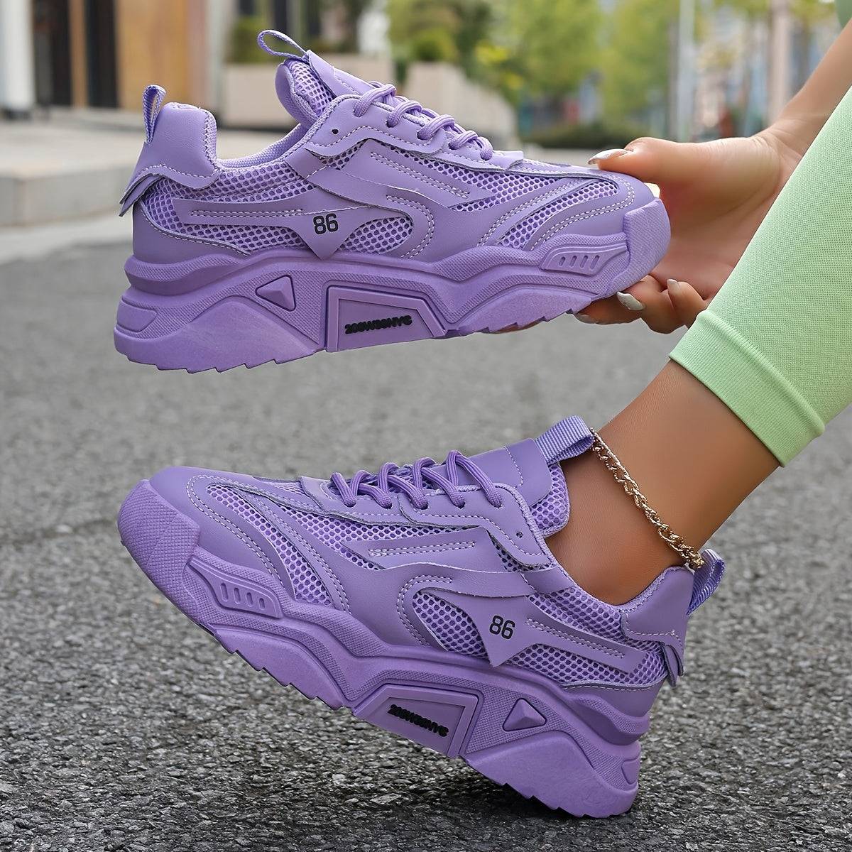 Women’s lavender low-top sneakers with cushioned sole and lace-up design, ideal for office wear and everyday comfort on urban streets.